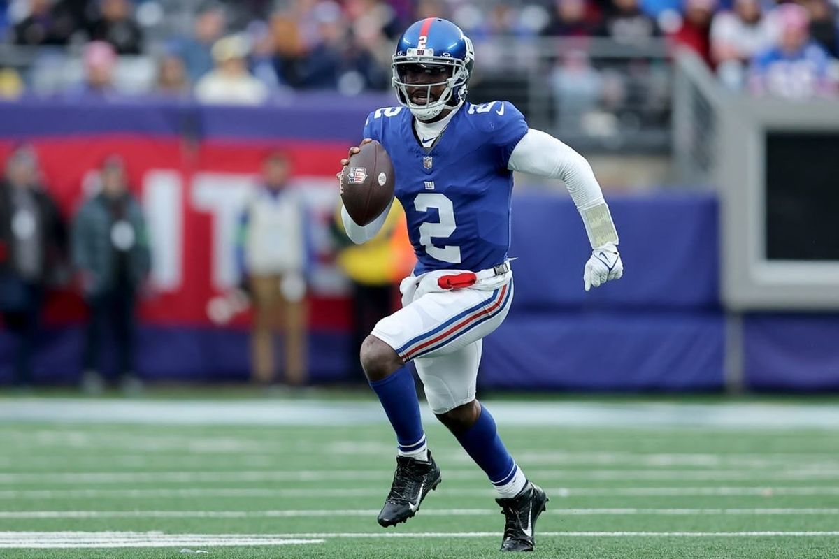 Dec 31, 2023; East Rutherford, New Jersey, USA; New York Giants quarterback Tyrod Taylor (2) runs with the ball against the Los Angeles Rams during the third quarter at MetLife Stadium.