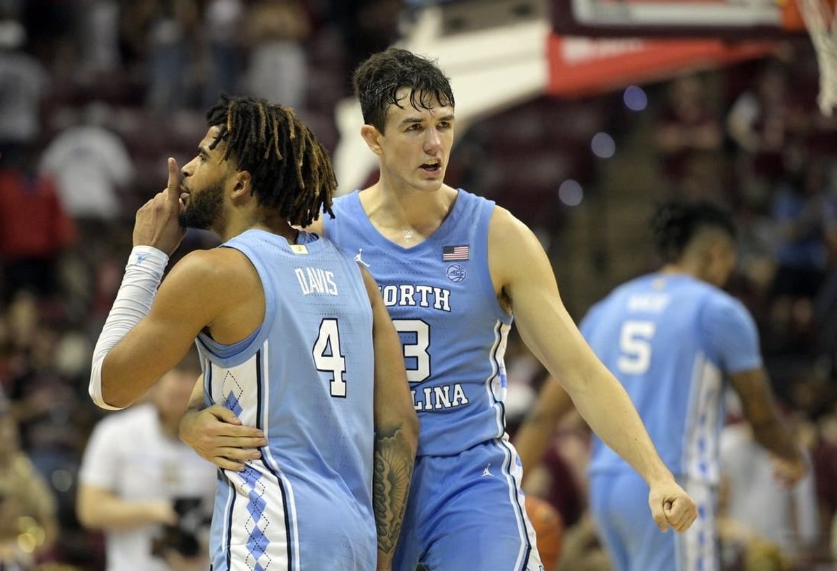 Jan 27, 2024; Tallahassee, Florida, USA; North Carolina Tarheels guard RJ Davis (4) and guard Cormac Ryan (3) celebrate after winning the game against the Florida State Seminoles at Donald L. Tucker Center.