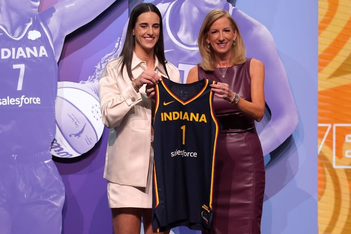 Apr 15, 2024; Brooklyn, NY, USA; Caitlin Clark poses with WNBA commissioner Cathy Engelbert after being selected with the number one overall pick to the Indiana Fever during the 2024 WNBA Draft at the Brooklyn Academy of Music.