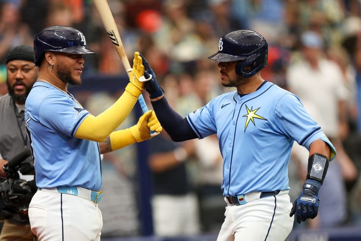 Apr 14, 2024; St. Petersburg, Florida, USA;  Tampa Bay Rays catcher René Pinto (50) is congratulated by designated hitter Harold Ramírez (43) after hitting a three run home run against the San Francisco Giants in the fourth inning at Tropicana Field.