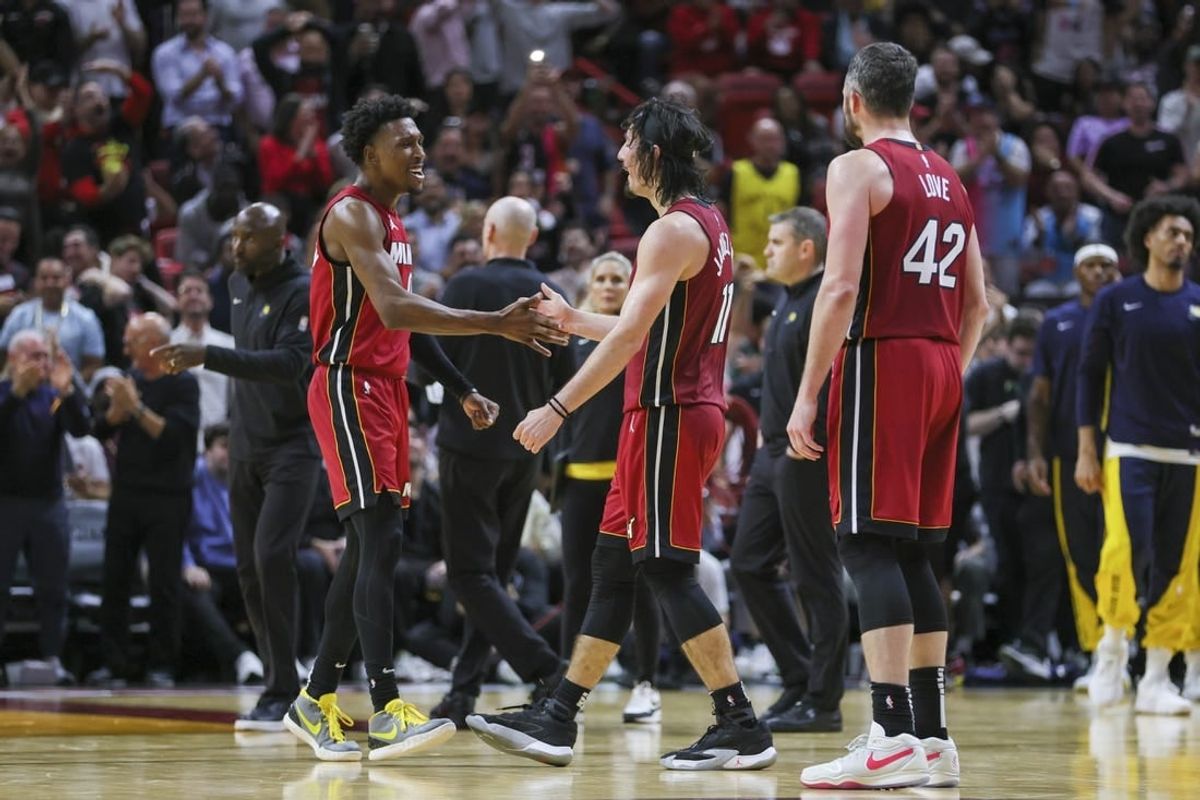 Nov 30, 2023; Miami, Florida, USA; Miami Heat guard Josh Richardson (0) celebrates with guard Jaime Jaquez Jr. (11) against the Indiana Pacers during the fourth quarter at Kaseya Center.