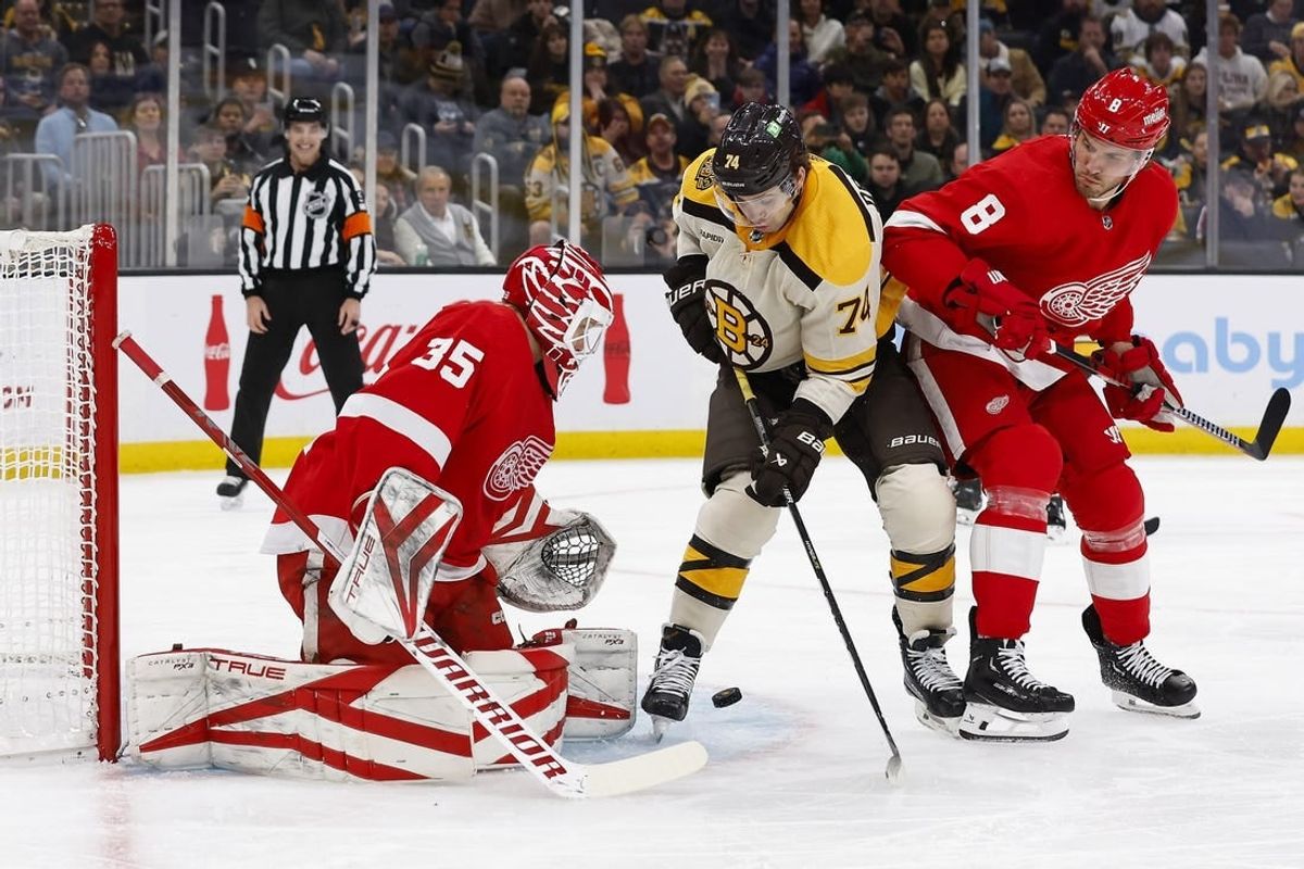 Nov 24, 2023; Boston, Massachusetts, USA; Boston Bruins left wing Jake DeBrusk (74) looks for a rebound in front of Detroit Red Wings goaltender Ville Husso (35) during the first period at TD Garden.