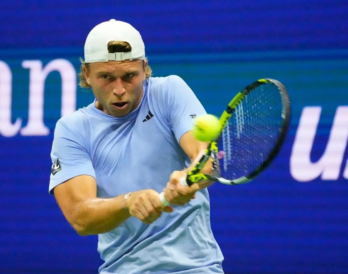 Aug 28, 2023; Flushing, NY, USA;  Alexandre Muller of France hits to Novak Djokovic of Serbia on day one of the 2023 U.S. Open tennis tournament at USTA Billie Jean King National Tennis Center.