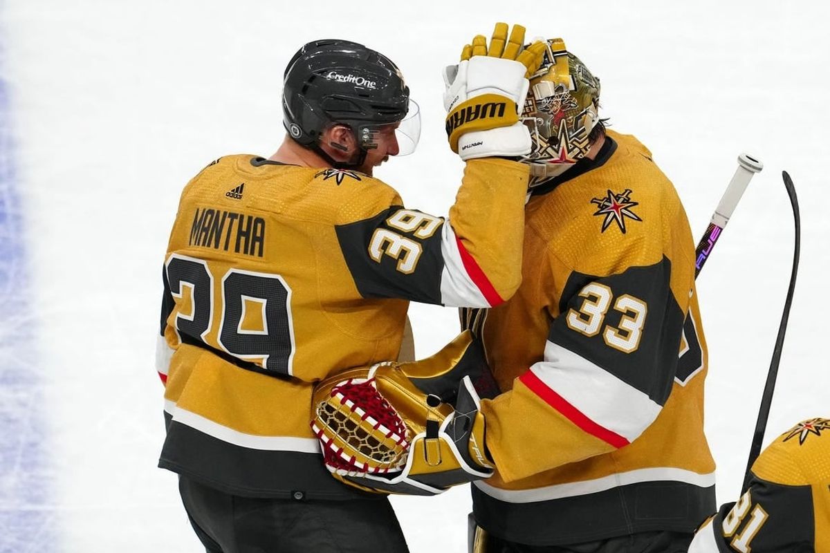 Apr 14, 2024; Las Vegas, Nevada, USA; Vegas Golden Knights right wing Anthony Mantha (39) celebrates with goaltender Adin Hill (33) after defeating the Colorado Avalanche 4-3 in overtime at T-Mobile Arena.