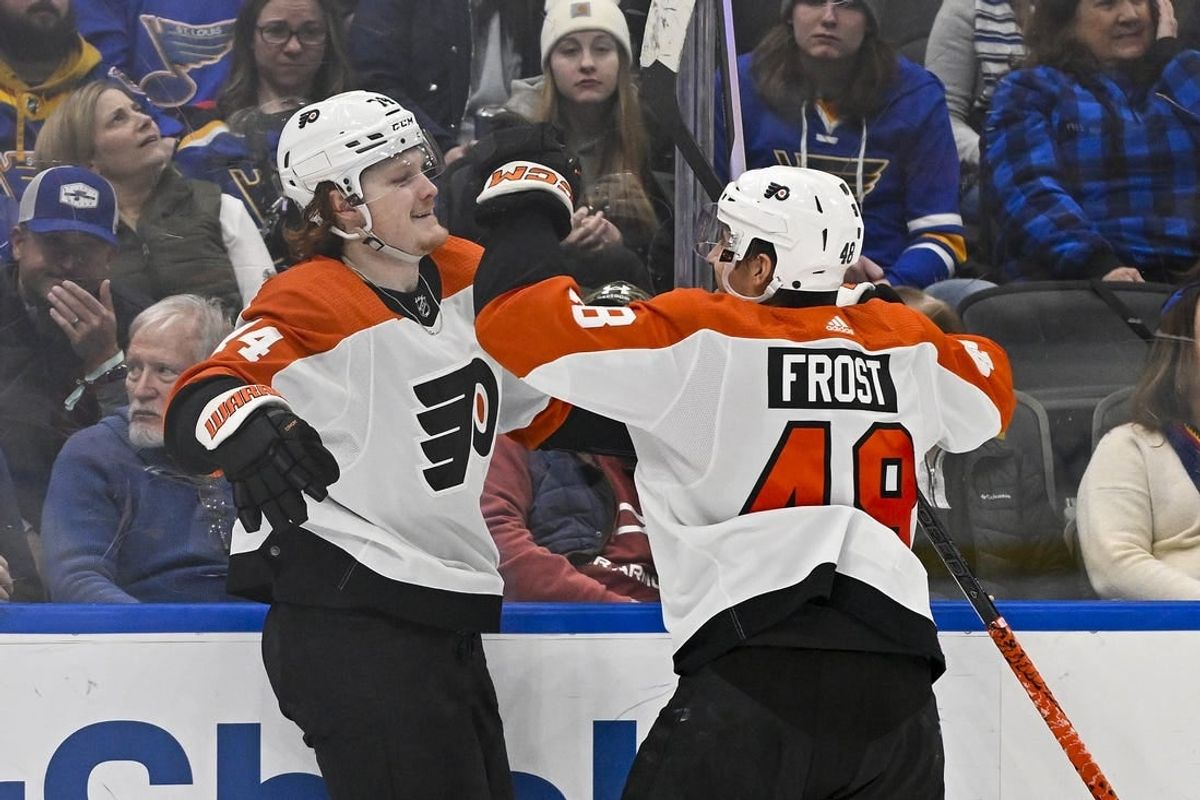 Jan 15, 2024; St. Louis, Missouri, USA;  Philadelphia Flyers right wing Owen Tippett (74) celebrates with center Morgan Frost (48) after scoring the game winning goal against the St. Louis Blues during the third period at Enterprise Center.