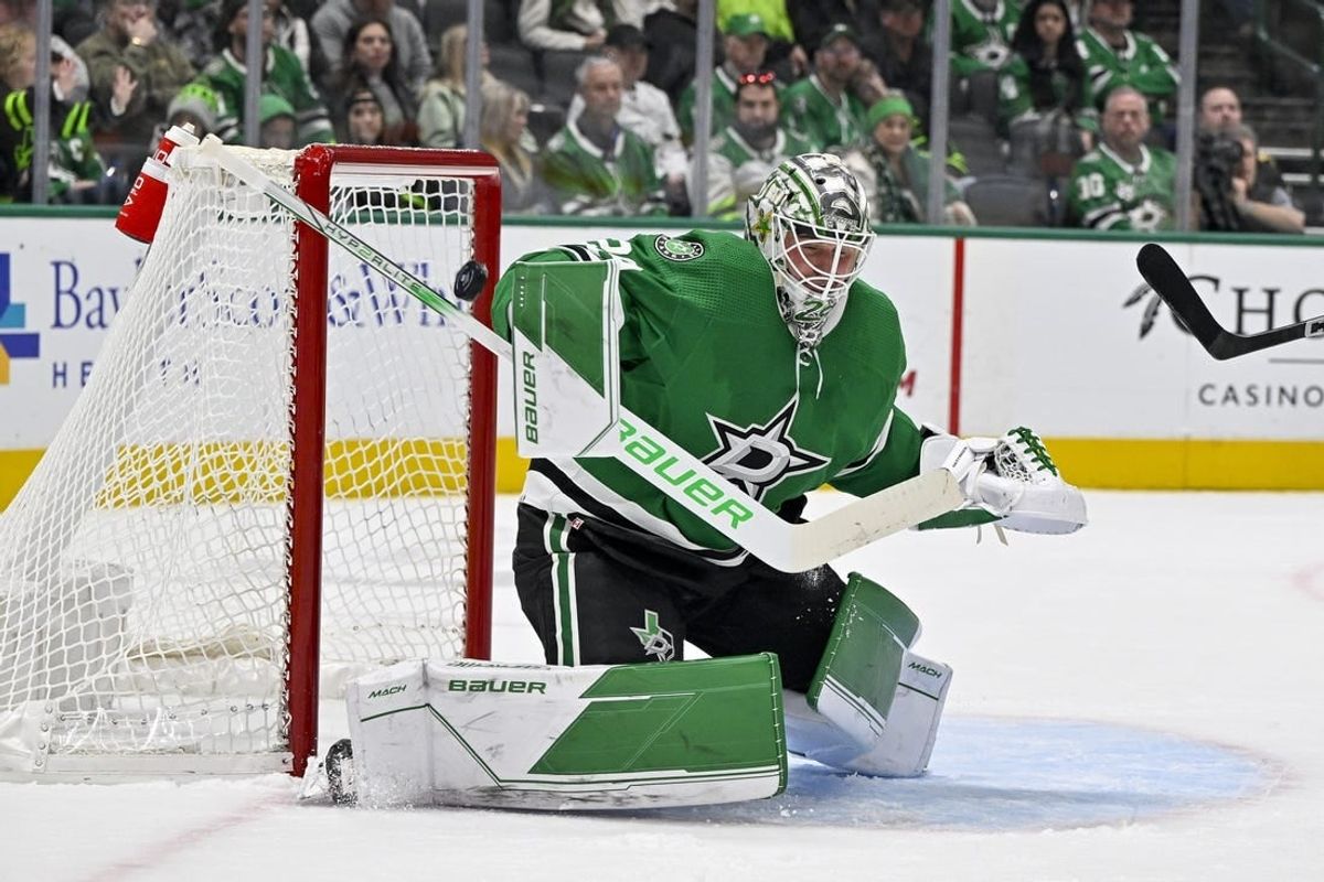 Dec 9, 2023; Dallas, Texas, USA; Dallas Stars goaltender Jake Oettinger (29) makes a stick save on a shot by the Vegas Golden Knights during the first period at the American Airlines Center.