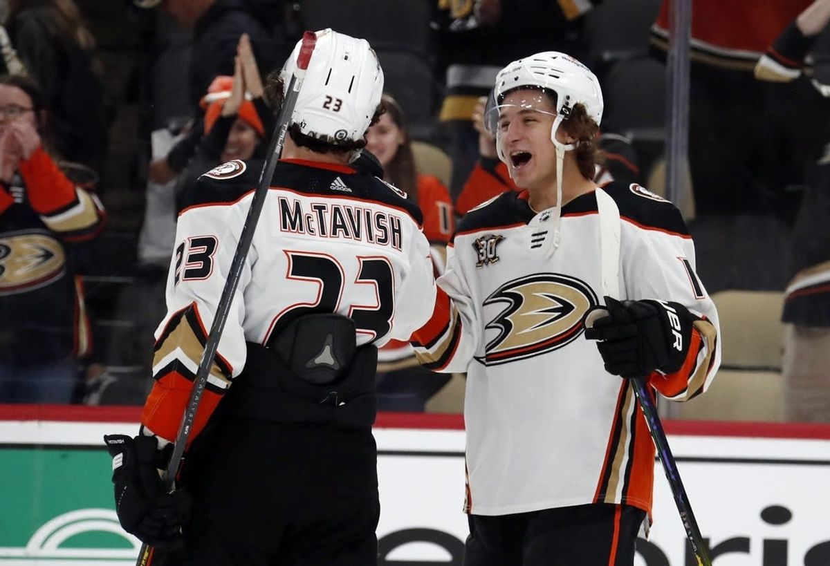 Oct 30, 2023; Pittsburgh, Pennsylvania, USA;  Anaheim Ducks center Mason McTavish (23) and center Trevor Zegras (right) celebrate after defeating the Pittsburgh Penguins at PPG Paints Arena.  Anaheim won 4-3.