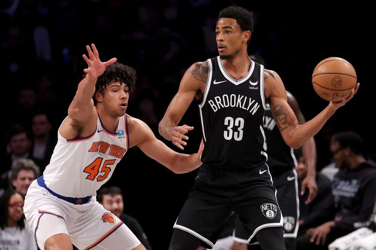 Jan 23, 2024; Brooklyn, New York, USA; Brooklyn Nets center Nic Claxton (33) looks to pass the ball against New York Knicks center Jericho Sims (45) during the first quarter at Barclays Center.