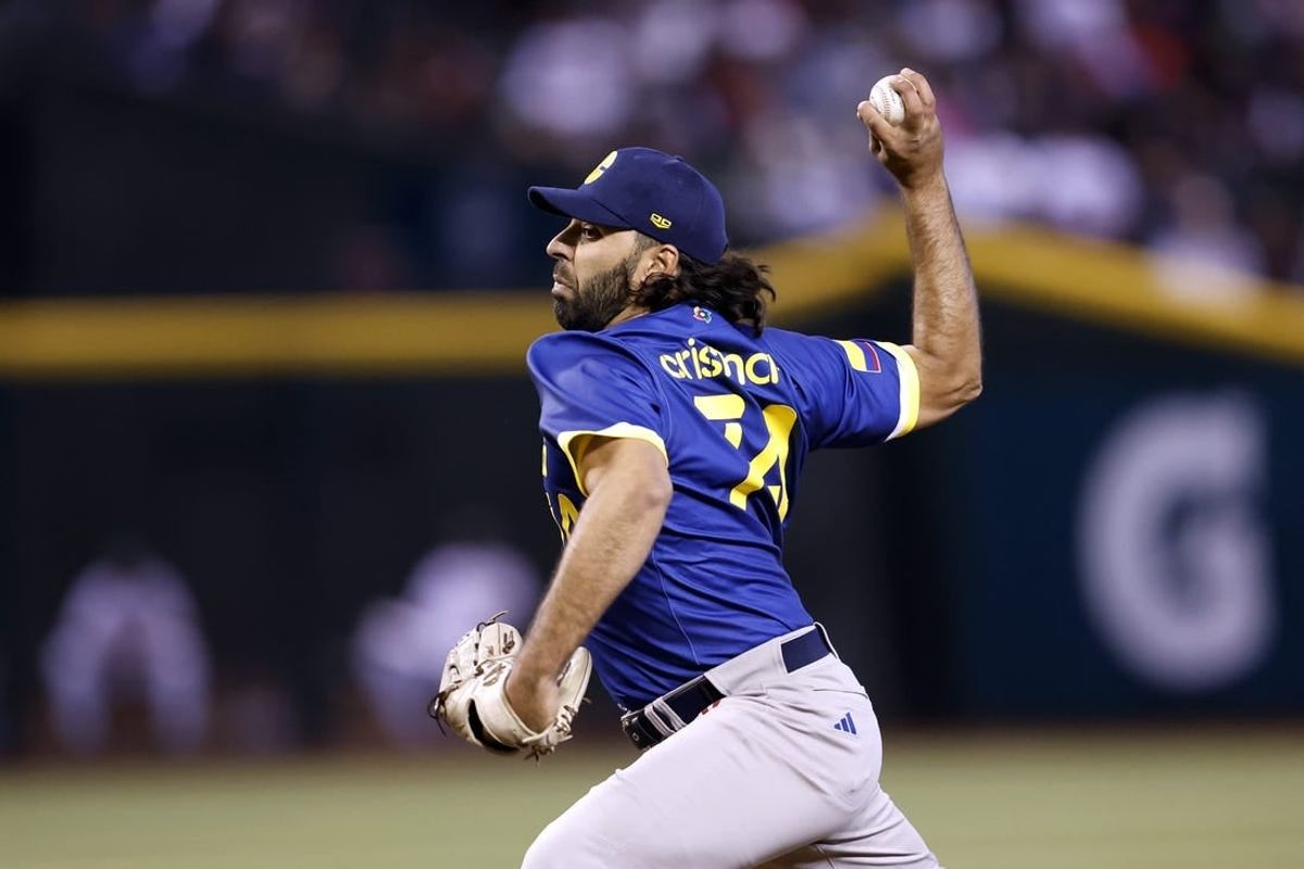 Mar 11, 2023; Phoenix, Arizona, USA;  Team Colombia starting pitcher Nabil Crismatt (74) pitches during the first inning against Team Mexico at Chase Field.