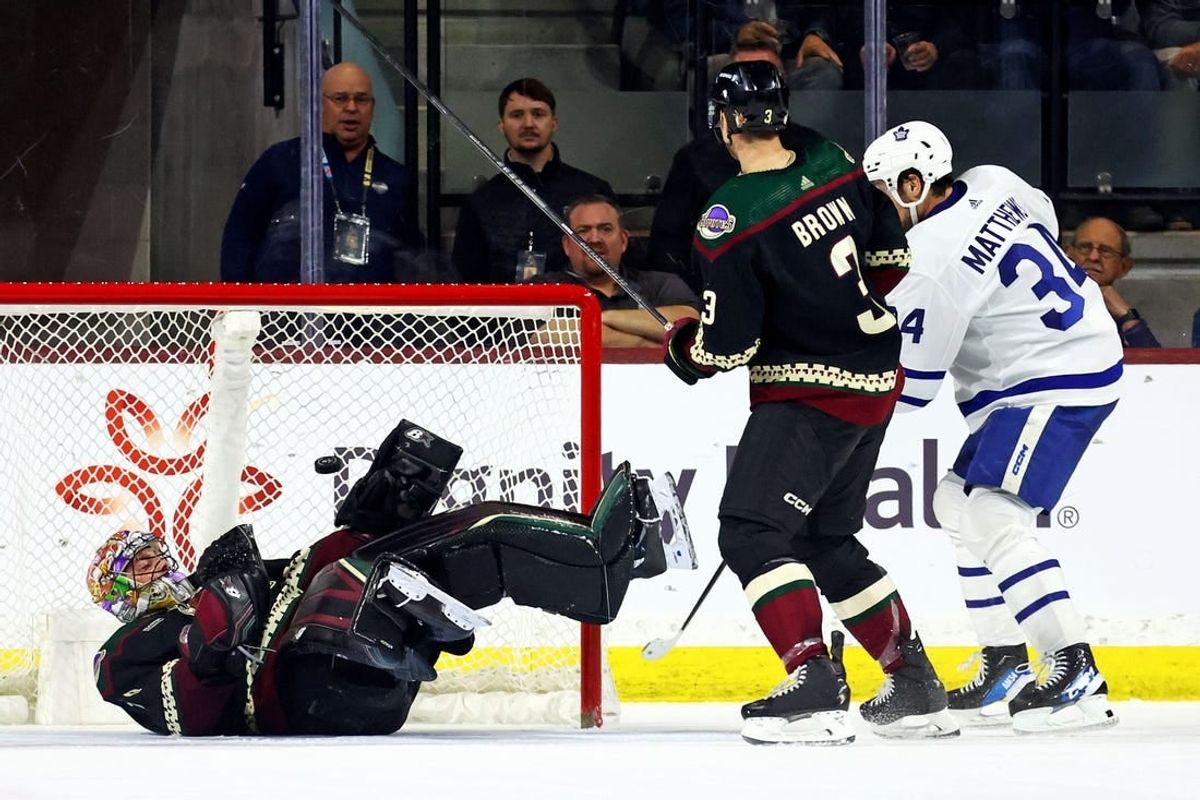 Feb 21, 2024; Tempe, Arizona, USA; Toronto Maple Leafs center Auston Matthews (34) scores a goal against Arizona Coyotes goaltender Karel Vejmelka (70) during the second period at Mullett Arena.
