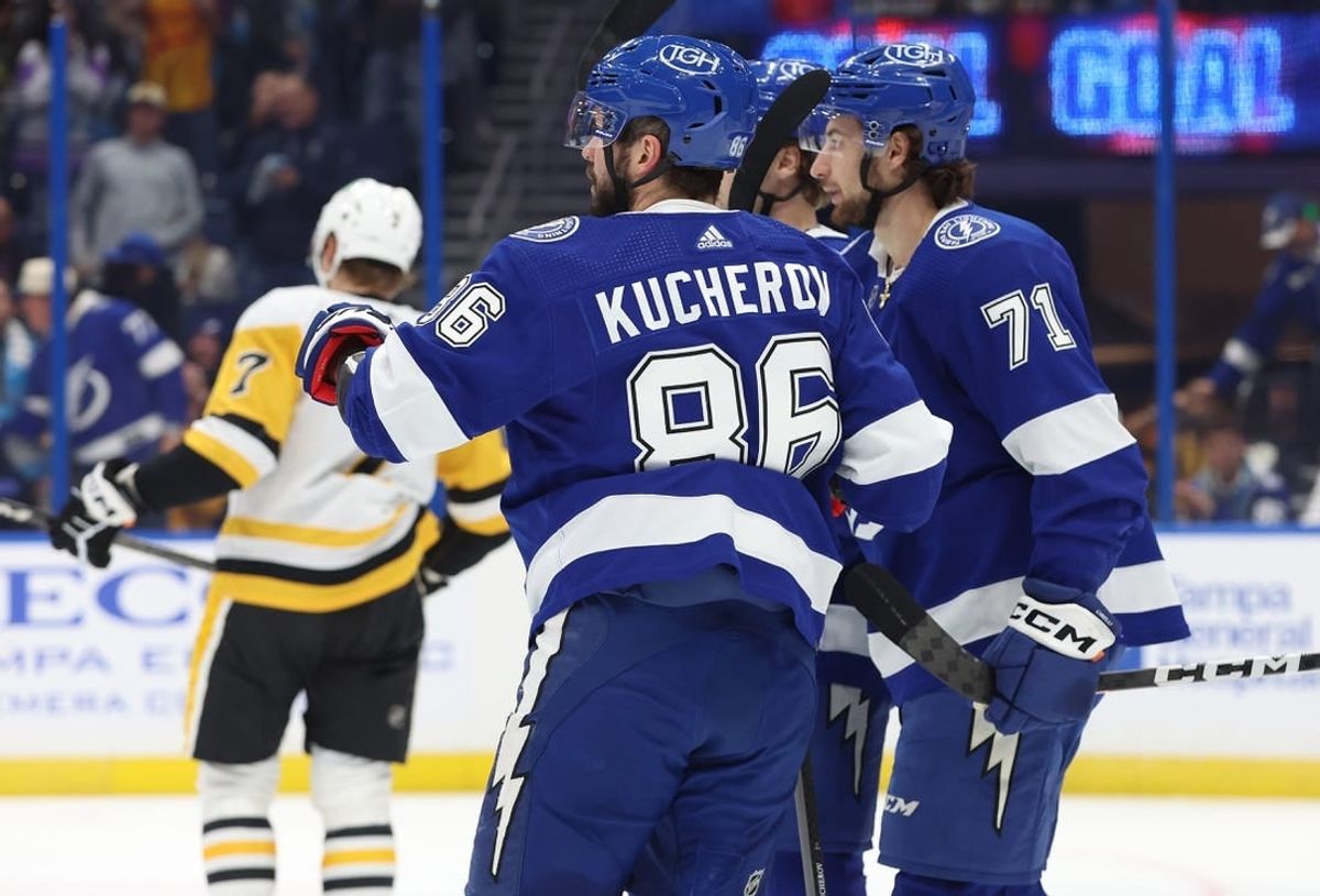 Dec 6, 2023; Tampa, Florida, USA; Tampa Bay Lightning center Anthony Cirelli (71) is congratulated by right wing Nikita Kucherov (86) and teammates after he scored a goal against the Pittsburgh Penguins during the first period at Amalie Arena.