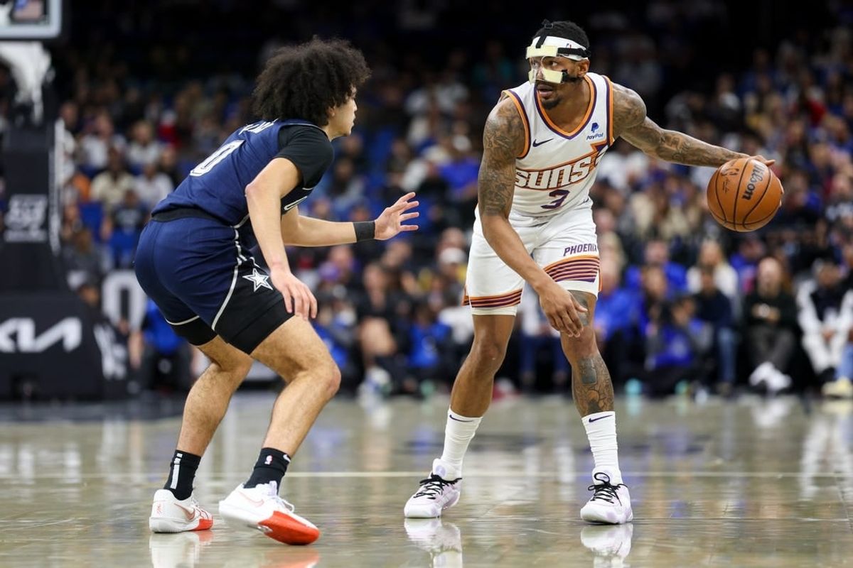 Jan 28, 2024; Orlando, Florida, USA;  Phoenix Suns guard Bradley Beal (3) controls the ball from Orlando Magic guard Anthony Black (0) in the second quarter at the Kia Center.