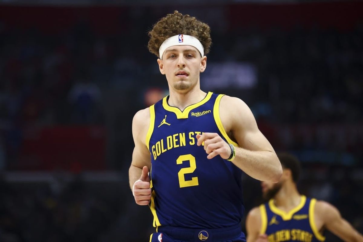 Dec 14, 2023; Los Angeles, California, USA; Golden State Warriors guard Brandin Podziemski (2) runs down the court during the first half of a game against the LA Clippers at Crypto.com Arena.
