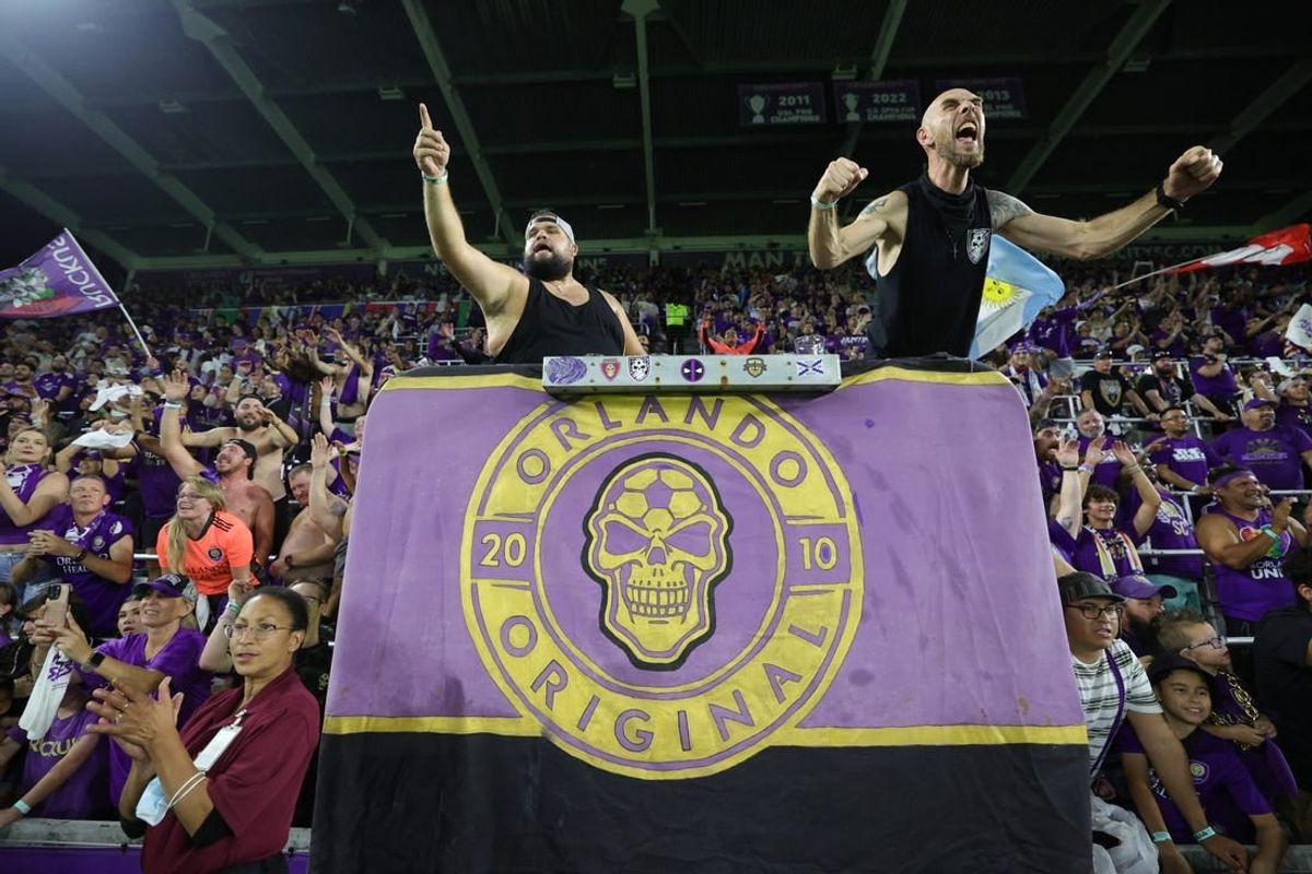 Oct 30, 2023; Orlando, Florida, USA; Orlando City fans celebrate after defeating the Nashville SC of game one in a round one match of the 2023 MLS Cup Playoffs at Exploria Stadium.