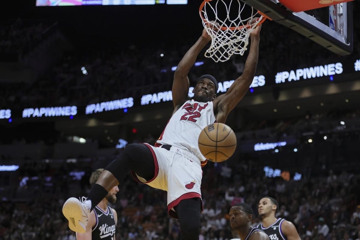 Jan 31, 2024; Miami, Florida, USA; Miami Heat forward Jimmy Butler (22) dunks the basketball against the Sacramento Kings during the third quarter at Kaseya Center.