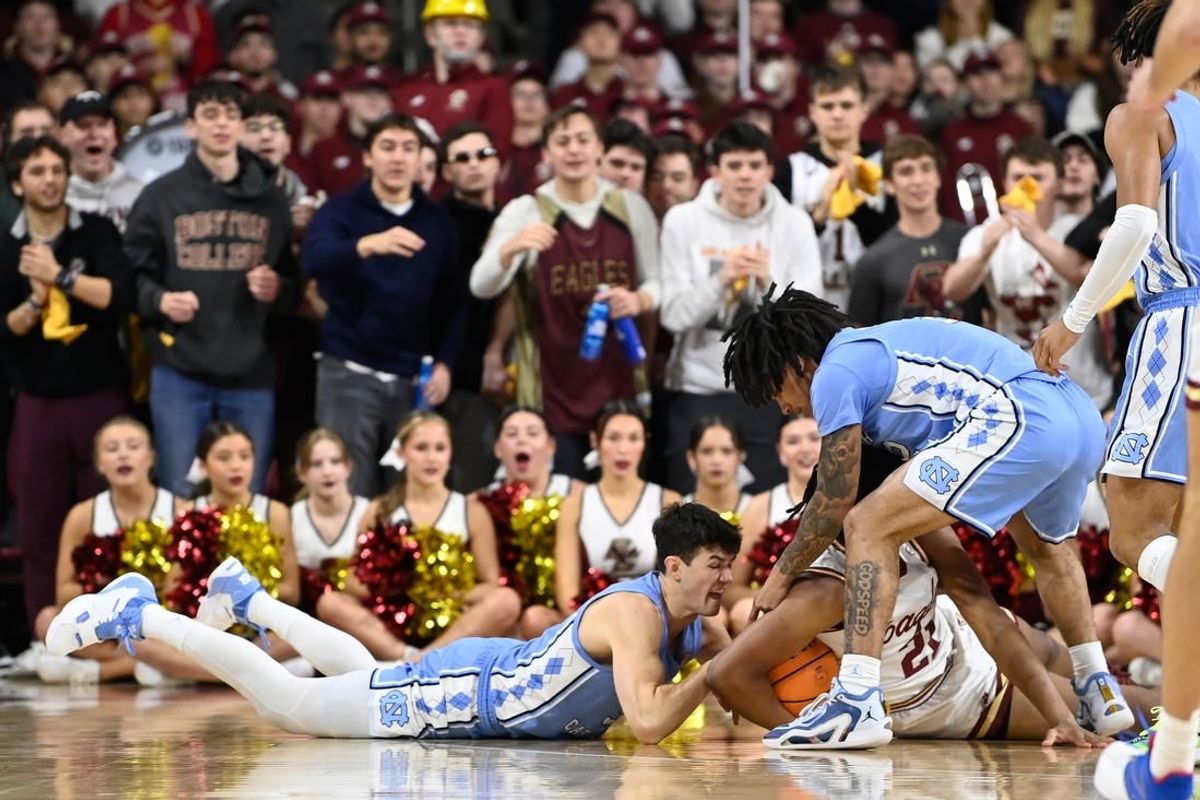 Jan 20, 2024; Chestnut Hill, Massachusetts, USA; North Carolina Tar Heels guard Cormac Ryan (3) and Boston College Eagles forward Devin McGlockton (21) battle for the ball during the first half at Conte Forum.