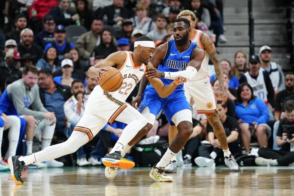 Mar 19, 2024; San Antonio, Texas, USA;  San Antonio Spurs guard Malaki Branham (22) dribbles against Dallas Mavericks forward Tim Hardaway Jr. (10) in the second half at Frost Bank Center.