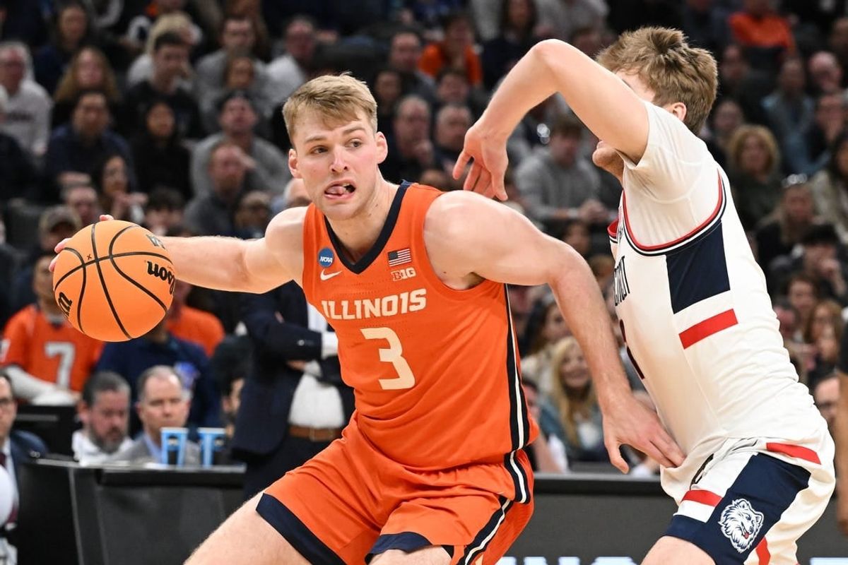 Mar 30, 2024; Boston, MA, USA;Illinois Fighting Illini forward Marcus Domask (3) dribbles the ball against Connecticut Huskies guard Cam Spencer (12) in the finals of the East Regional of the 2024 NCAA Tournament at TD Garden.