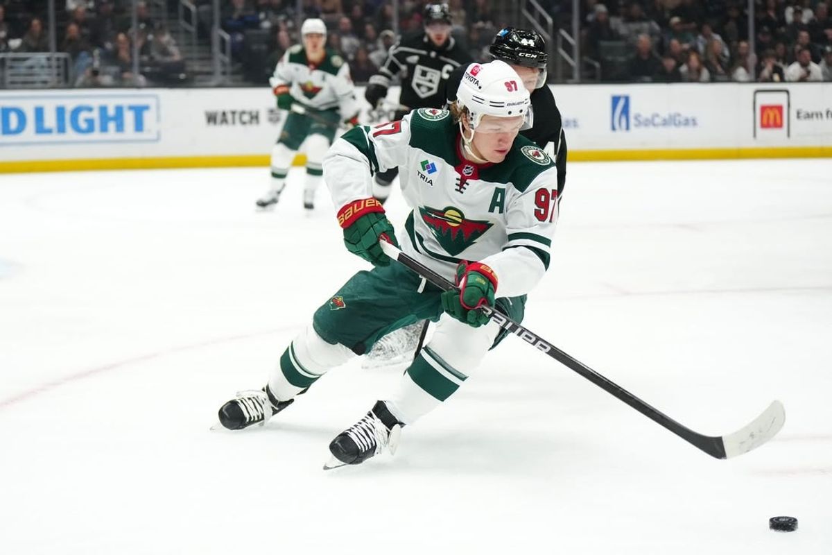Apr 15, 2024; Los Angeles, California, USA; Minnesota Wild left wing Kirill Kaprizov (97) pursues the puck against LA Kings defenseman Mikey Anderson (44) in the first period at Crypto.com Arena.