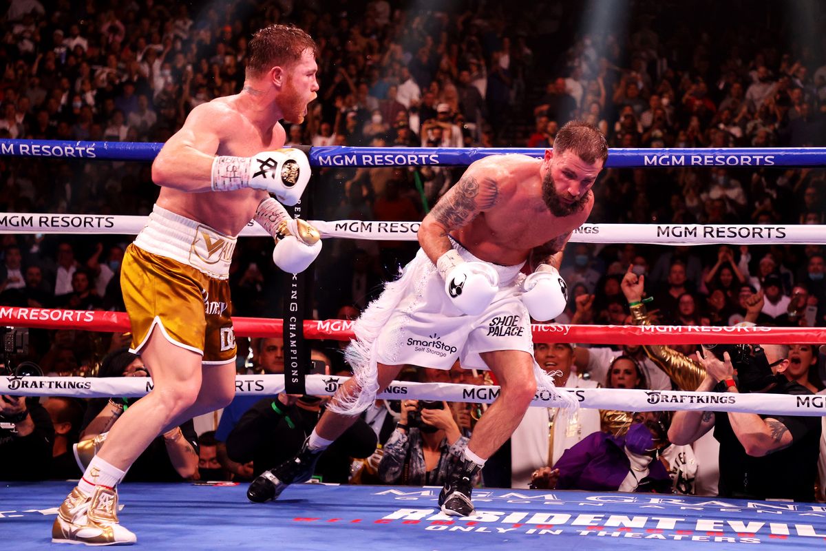 Canelo Alvarez (L) punches Caleb Plant against the ropes during their championship bout for Alvarez’s WBC, WBO,  and WBA super-middleweight  titles and Plant’s IBF super-middleweight  title at MGM Grand Garden Arena.