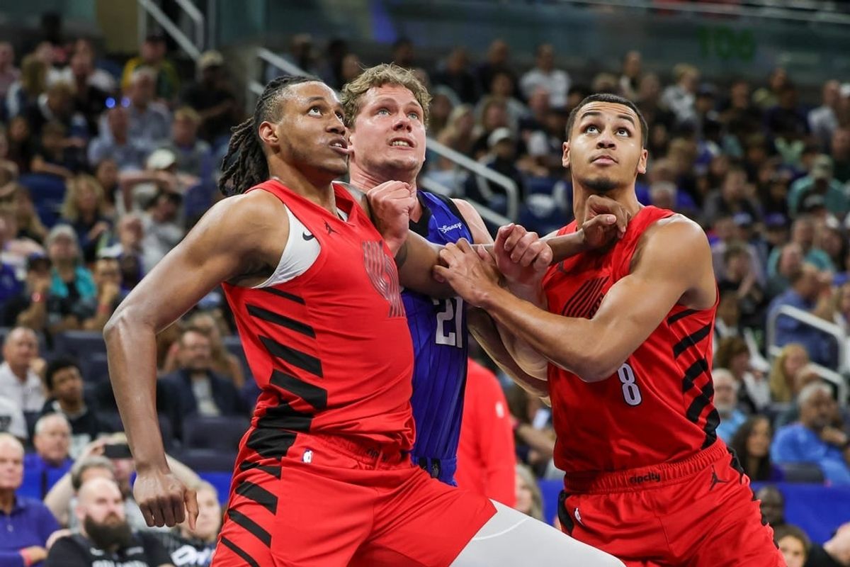Apr 1, 2024; Orlando, Florida, USA; Portland Trail Blazers forward Jabari Walker (34) forward Kris Murray (8) and Orlando Magic center Moritz Wagner (21) look for the rebound during the second half at Amway Center.