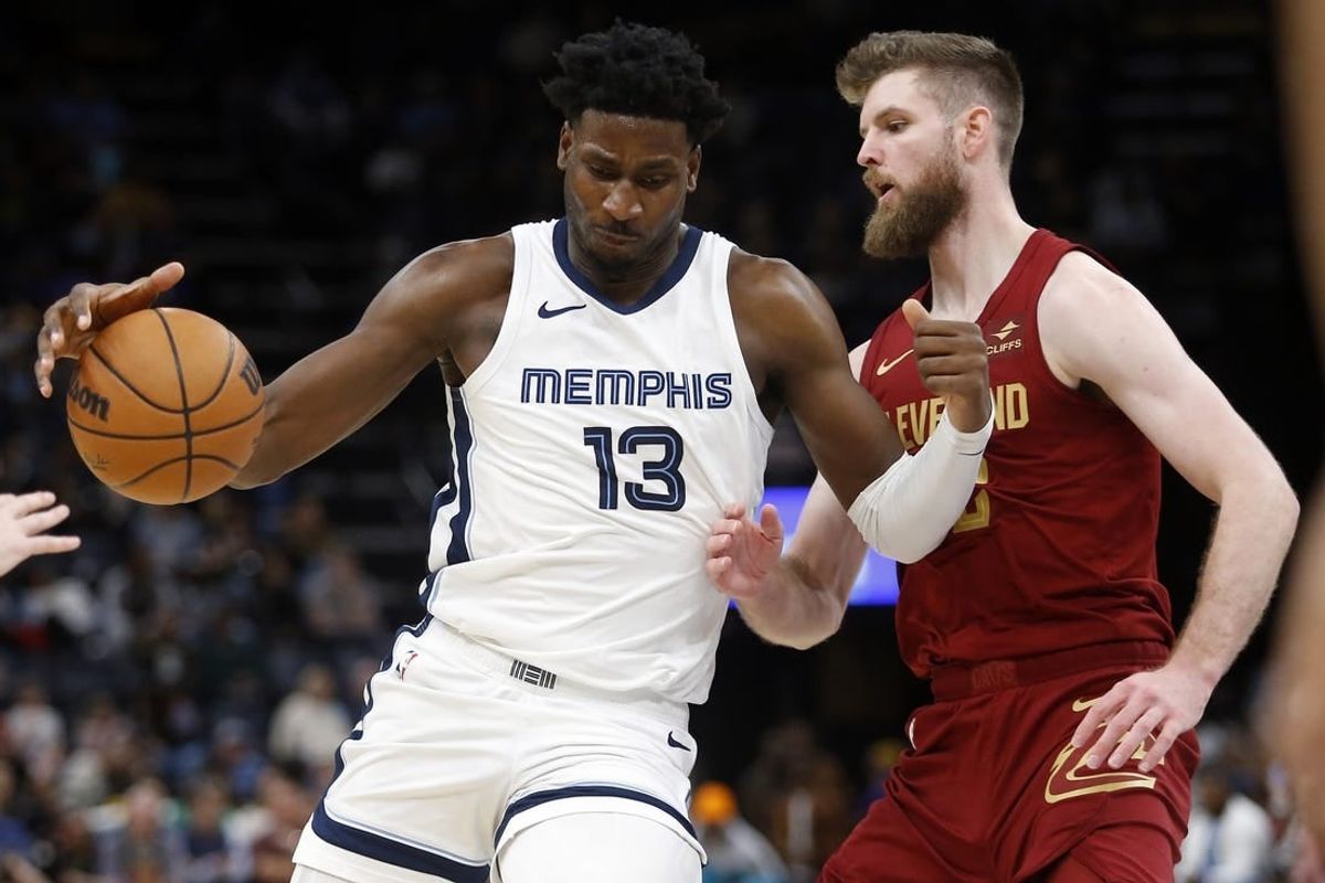 Feb 1, 2024; Memphis, Tennessee, USA; Memphis Grizzlies forward-center Jaren Jackson Jr. (13) drives to the basket as Cleveland Cavaliers forward Dean Wade (32) defends during the second half at FedExForum.