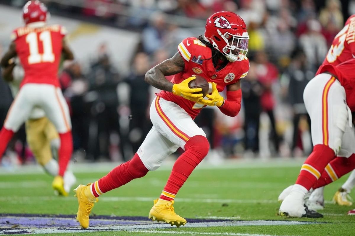 Feb 11, 2024; Paradise, Nevada, USA; Kansas City Chiefs wide receiver Rashee Rice (4) runs with the ball against the San Francisco 49ers during the second quarter of Super Bowl LVIII at Allegiant Stadium.