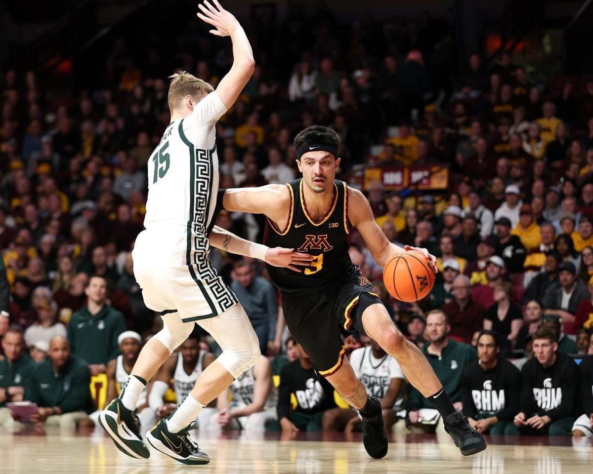 Feb 6, 2024; Minneapolis, Minnesota, USA; Minnesota Golden Gophers forward Dawson Garcia (3) works around Michigan State Spartans center Carson Cooper (15) during the first half at Williams Arena.