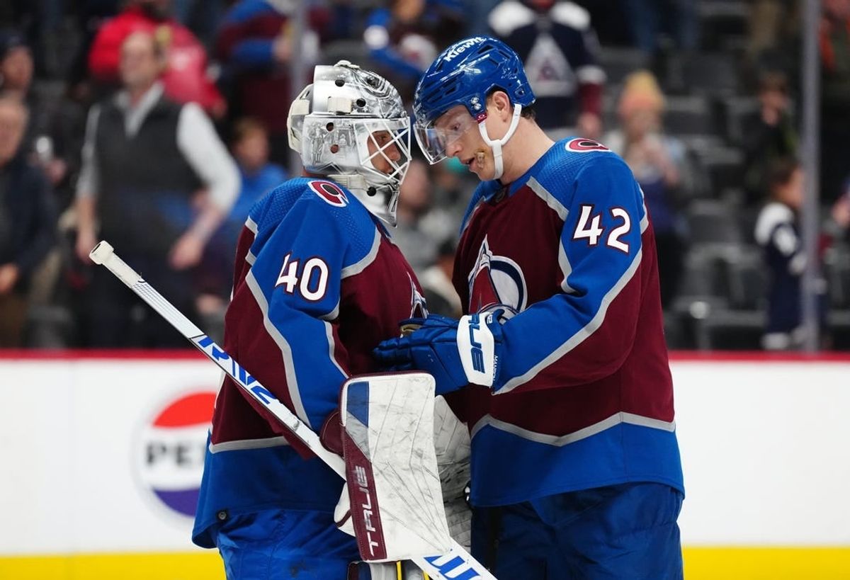Nov 27, 2023; Denver, Colorado, USA; Colorado Avalanche goaltender Alexandar Georgiev (40) and defenseman Josh Manson (42) celebrate the win over the Tampa Bay Lightning at Ball Arena.