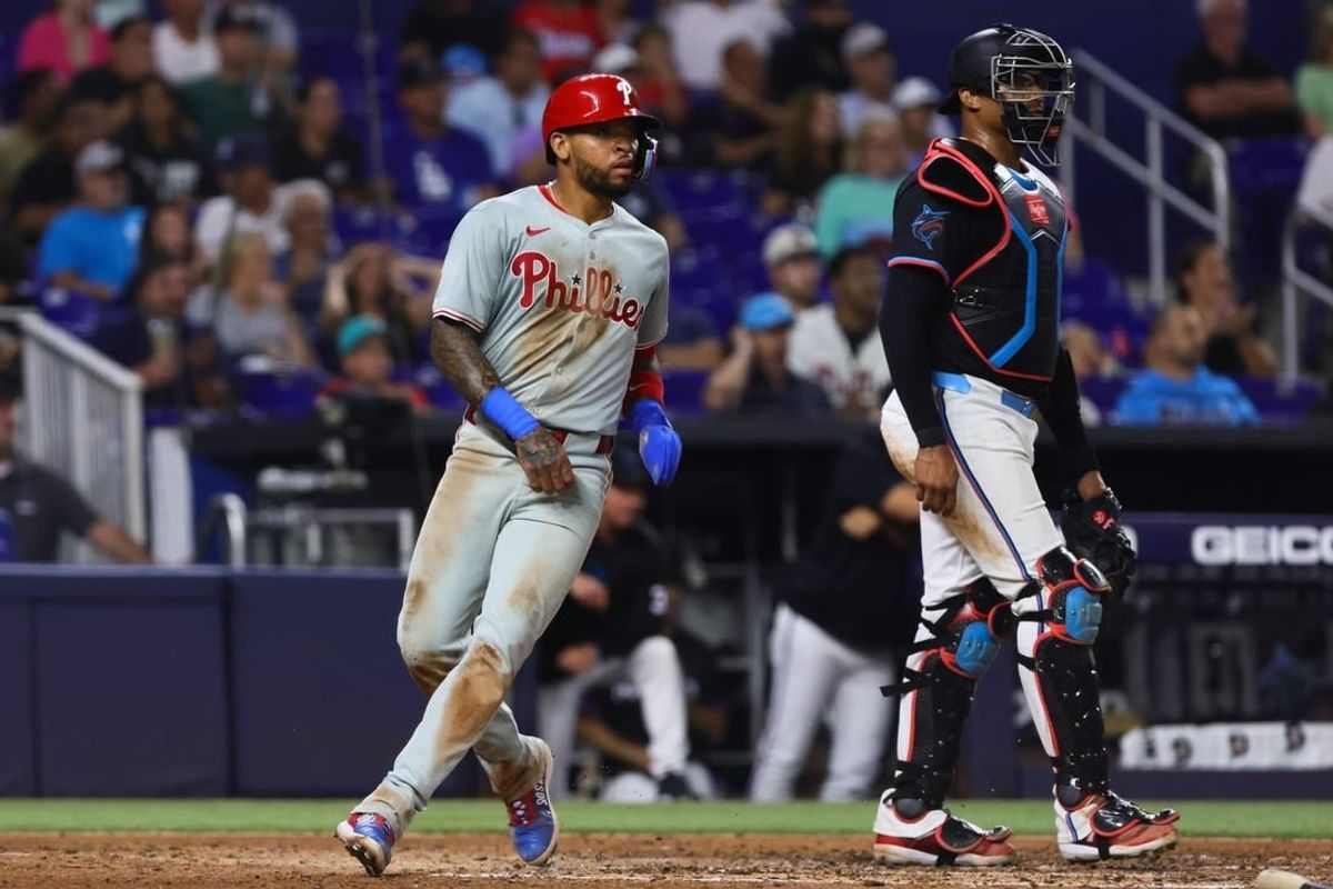 May 10, 2024; Miami, Florida, USA; Philadelphia Phillies shortstop Edmundo Sosa (33) scores against the Miami Marlins during the fourth inning at loanDepot Park.