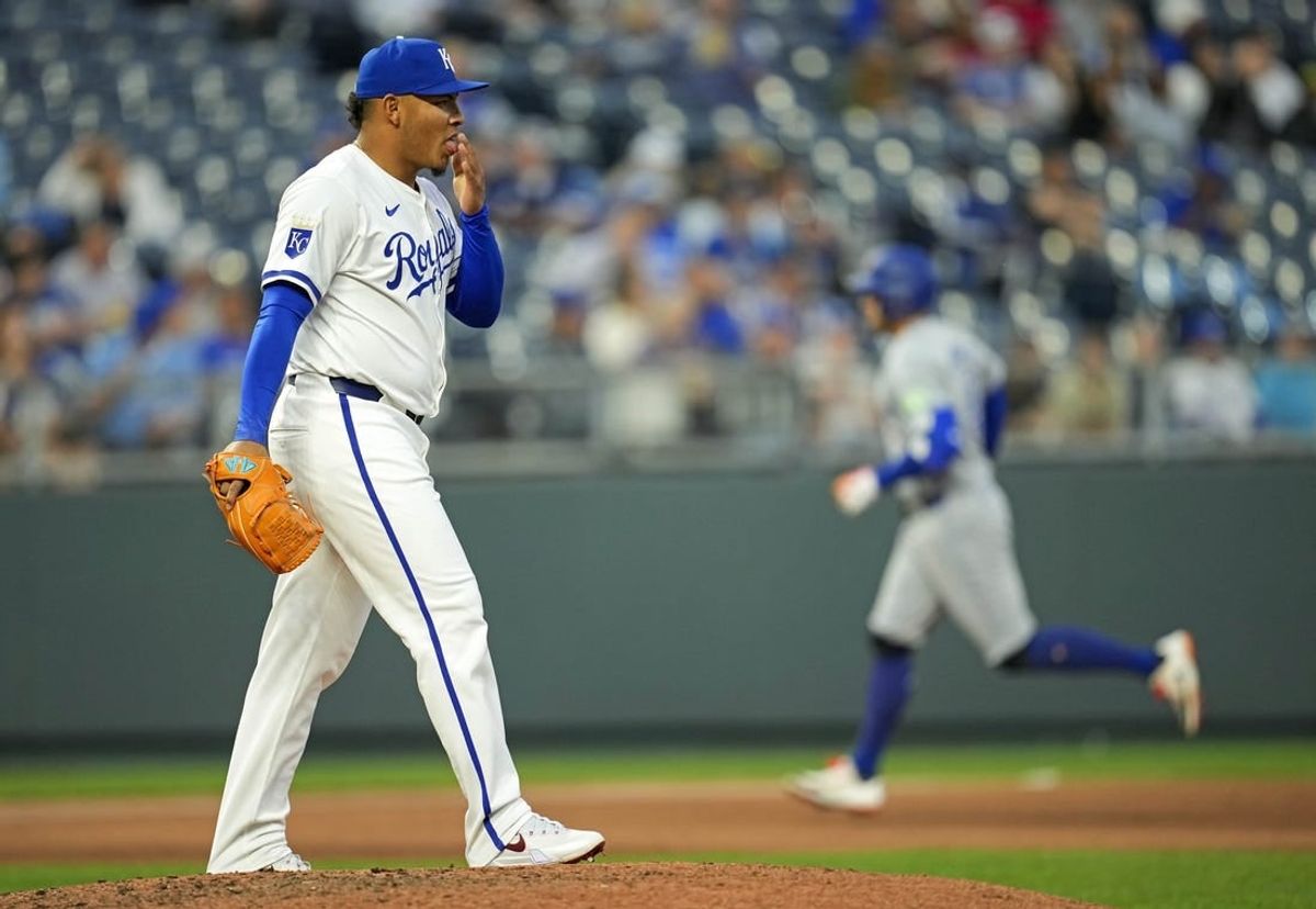 Apr 24, 2024; Kansas City, Missouri, USA; Kansas City Royals pitcher Angel Zerpa (61) reacts after giving up a home run to Toronto Blue Jays outfielder George Springer (4) during the fifth inning at Kauffman Stadium.