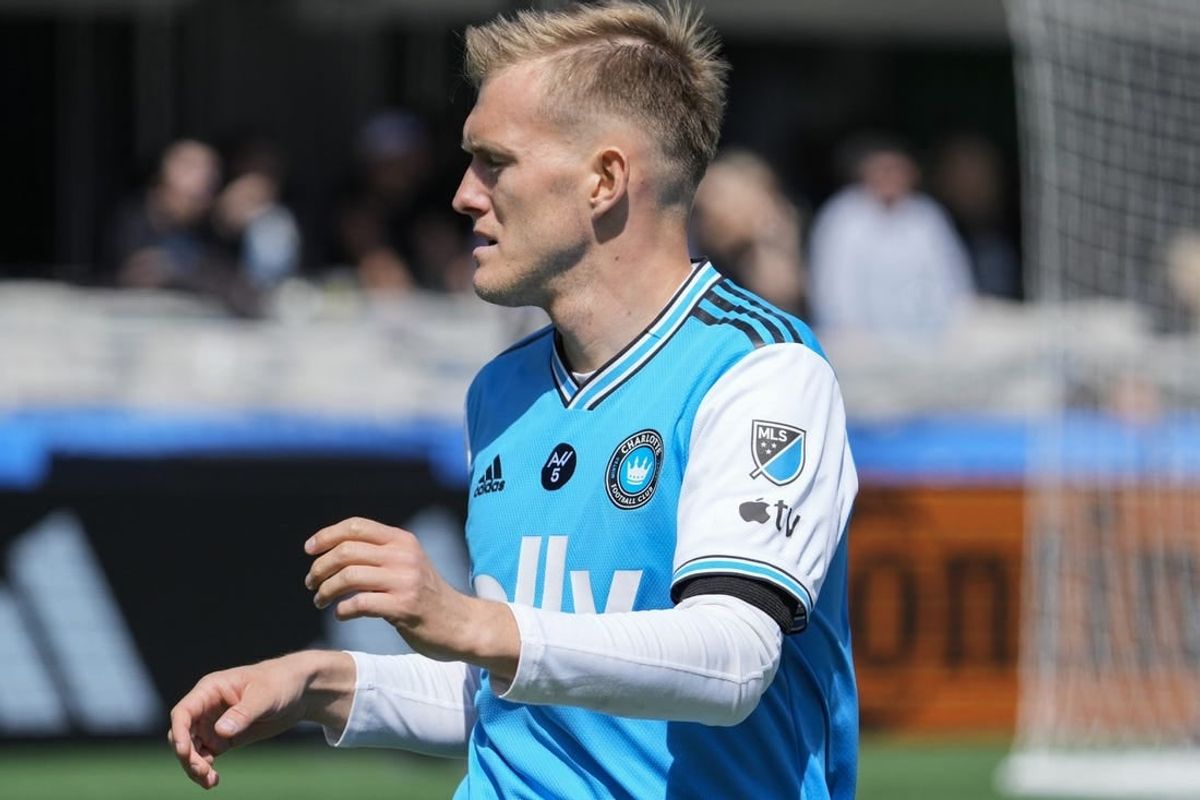 Mar 11, 2023; Charlotte, North Carolina, USA; Charlotte FC forward Karol Swiderski (11) wears the Apple logo on his kit during the first half against the Atlanta United at Bank of America Stadium.