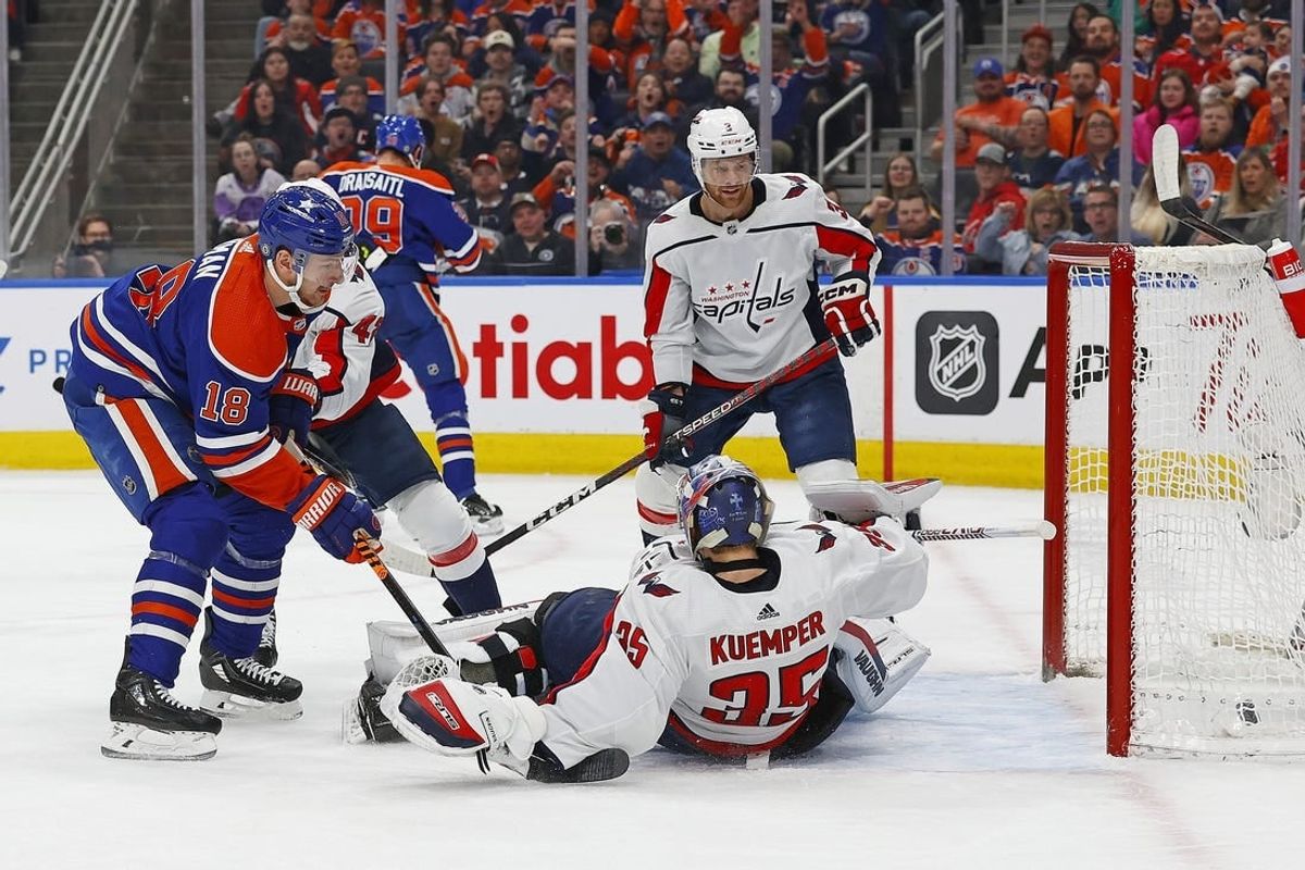 Mar 13, 2024; Edmonton, Alberta, CAN; Edmonton Oilers forward Zach Hyman (18) scores a goal during the first period against Washington Capitals goaltender Darcy Kuemper (35) at Rogers Place.