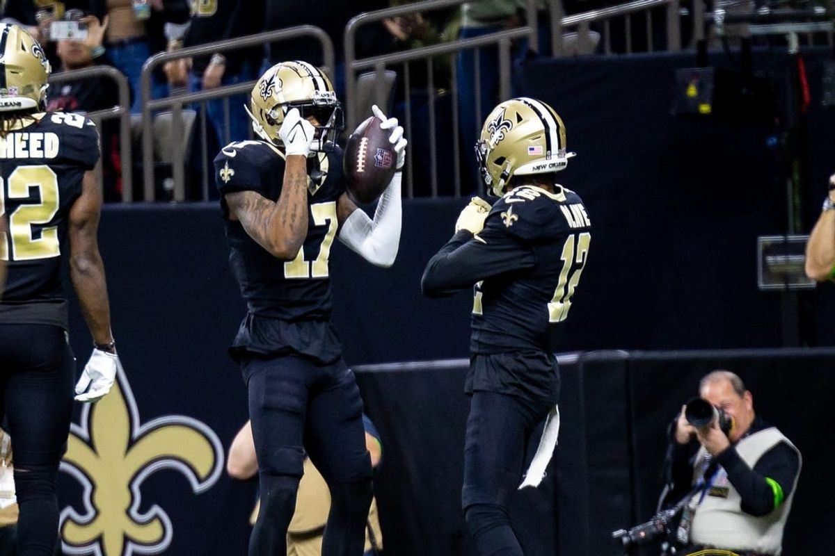 Jan 7, 2024; New Orleans, Louisiana, USA;  New Orleans Saints wide receiver A.T. Perry (17) celebrates a touchdown with wide receiver Chris Olave (12) against the Atlanta Falcons during the first half at Caesars Superdome.