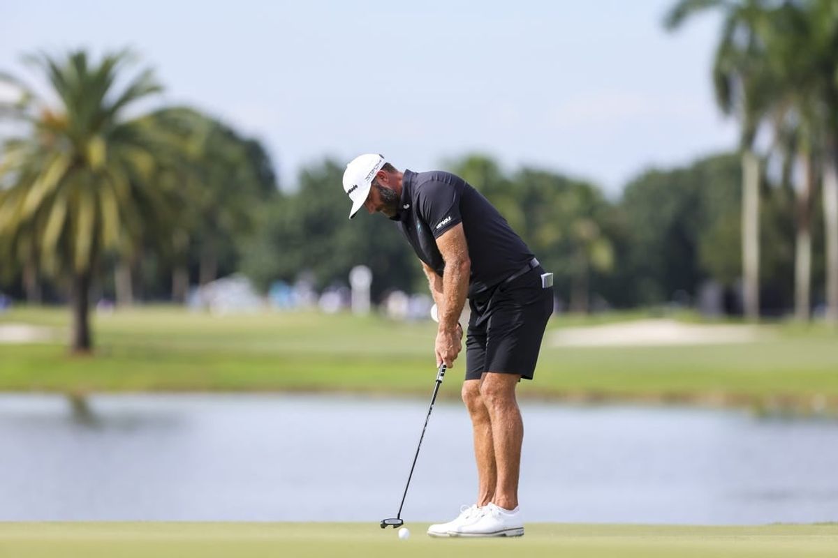 Oct 22, 2023; Doral, Florida, USA; Dustin Johnson putts on the eighth green during the final round of the LIV Golf Miami golf tournament at Trump National Doral.