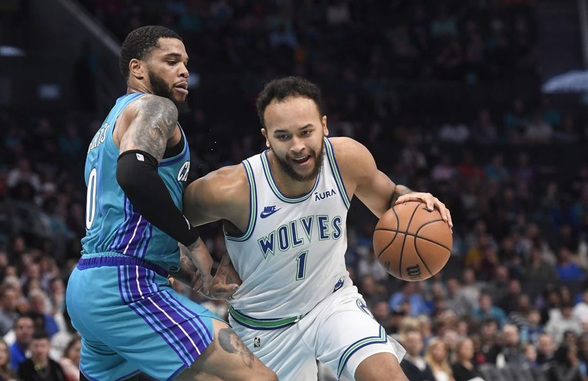 Dec 2, 2023; Charlotte, North Carolina, USA;  Minnesota Timberwolves forward Kyle Anderson (1) drives past Charlotte Hornets forward Miles Bridges (0) during the first half at the Spectrum Center.