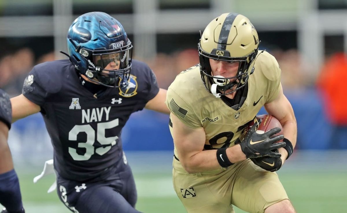 Dec 9, 2023; Foxborough, Massachusetts, USA; Army Black Knights wide receiver Casey Reynolds (87) is chased by Navy Midshipmen safety Kush'i Abraham (35) during the first half of the Army-Navy Game at Gillette Stadium.