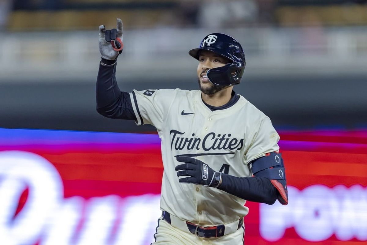 Apr 9, 2024; Minneapolis, Minnesota, USA; Minnesota Twins shortstop Carlos Correa (4) celebrates rounding second base after hitting a solo home run against the Los Angeles Dodgers in the ninth inning at Target Field.