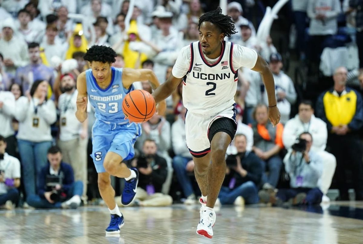 Jan 17, 2024; Storrs, Connecticut, USA; Connecticut Huskies guard Tristen Newton (2) returns the ball against Creighton Bluejays guard Trey Alexander (23) in the second half at Harry A. Gampel Pavilion.