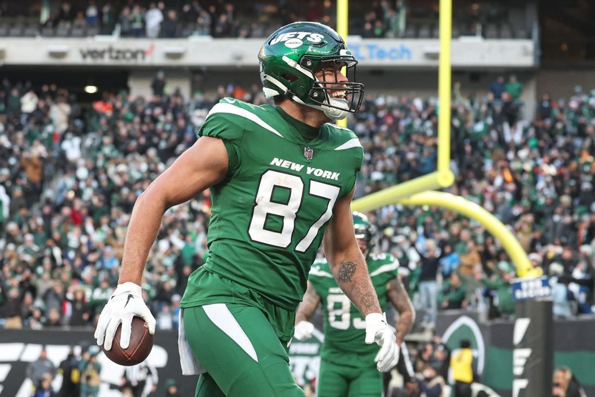 New York Jets tight end C.J. Uzomah (87) celebrates his touchdown reception against the Detroit Lions during the second half at MetLife Stadium.