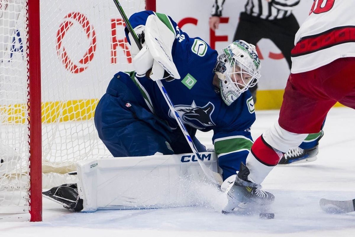 Dec 9, 2023; Vancouver, British Columbia, CAN; Vancouver Canucks goalie Thatcher Demko (35) makes a save against the Carolina Hurricanes in the second period at Rogers Arena.