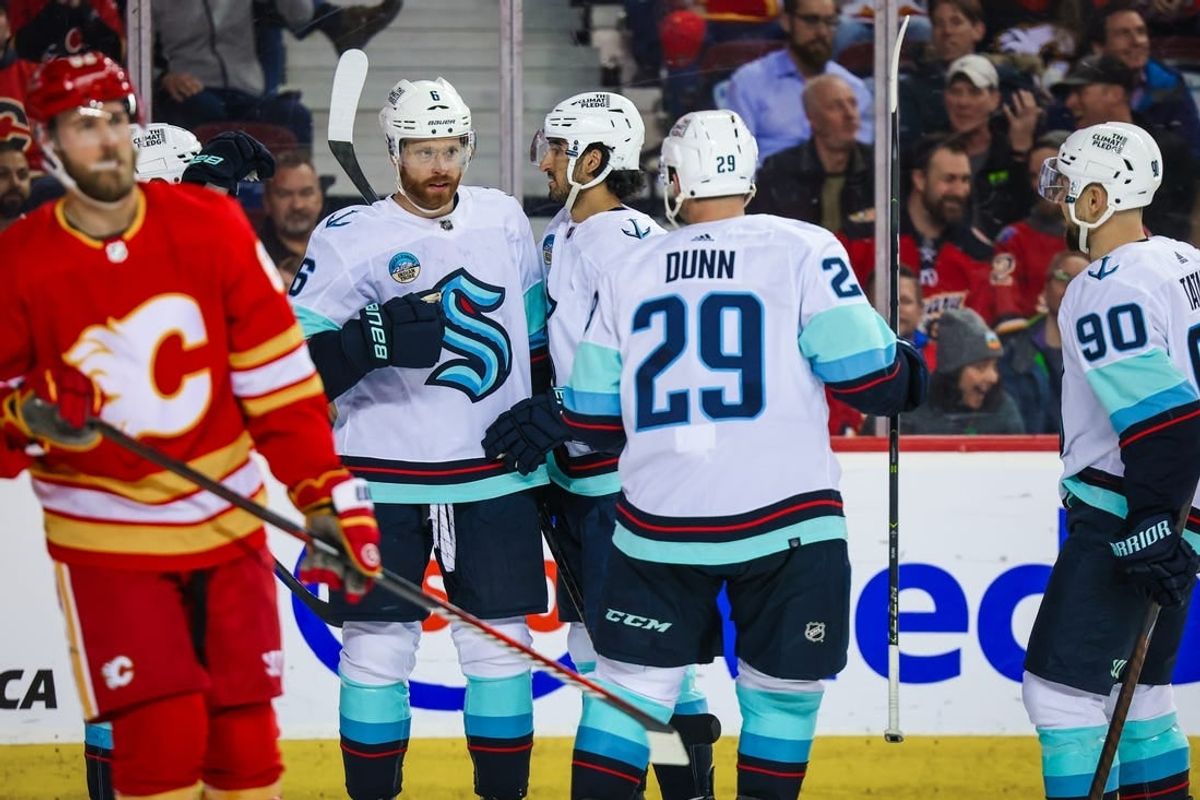 Mar 4, 2024; Calgary, Alberta, CAN; Seattle Kraken defenseman Adam Larsson (6) celebrates his goal with teammates against the Calgary Flames during the third period at Scotiabank Saddledome.