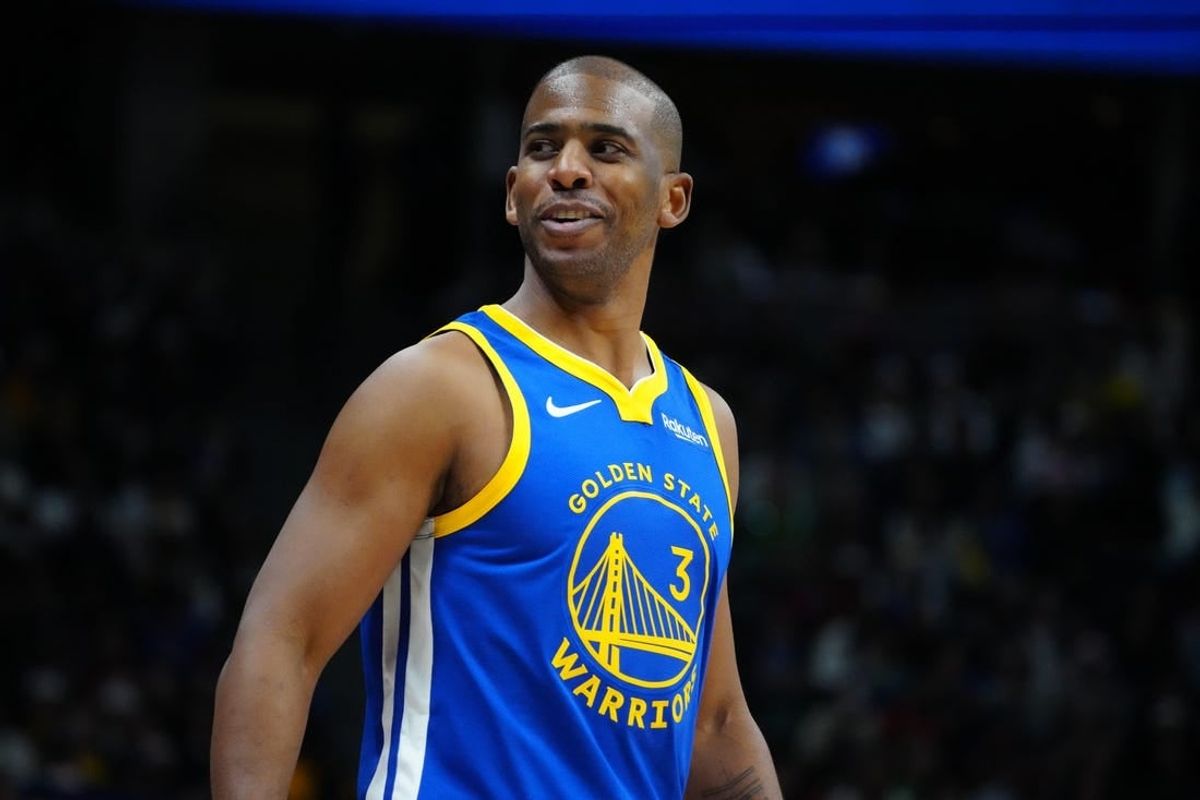 Dec 25, 2023; Denver, Colorado, USA; Golden State Warriors guard Chris Paul (3) reacts back to the Denver Nuggets bench in the third quarter at Ball Arena.