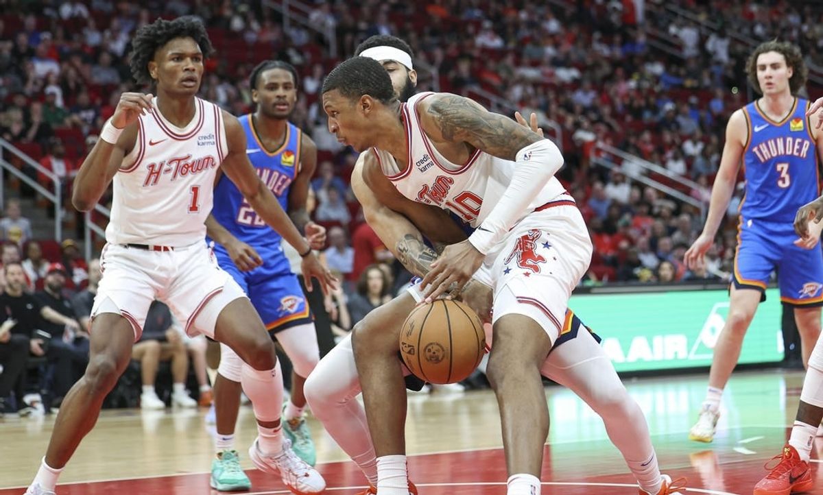 Feb 25, 2024; Houston, Texas, USA; Houston Rockets forward Jabari Smith Jr. (10) loses control of the ball during the second quarter against the Oklahoma City Thunder at Toyota Center.