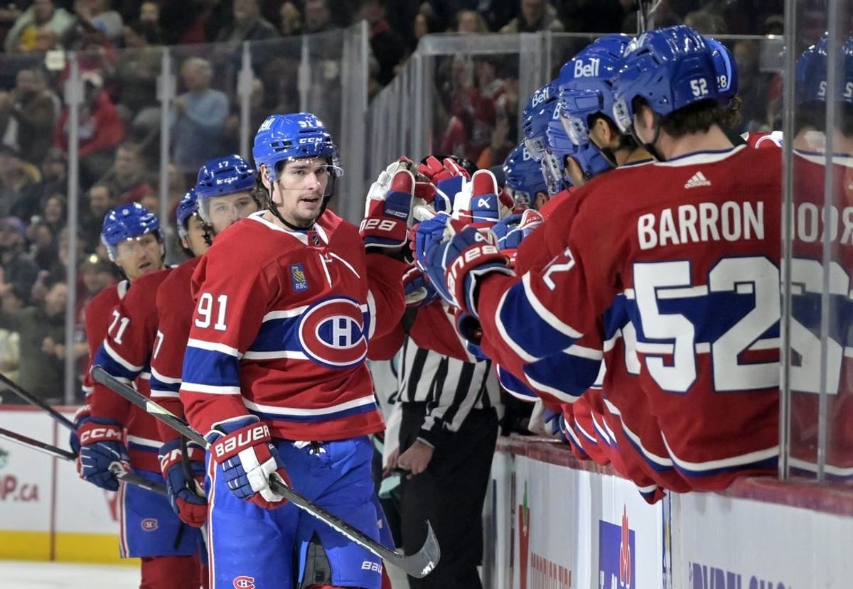 Dec 4, 2023; Montreal, Quebec, CAN; Montreal Canadiens forward Sean Monahan (91) celebrates with teammates after scoring a goal against the Seattle Kraken during the first period at the Bell Centre.