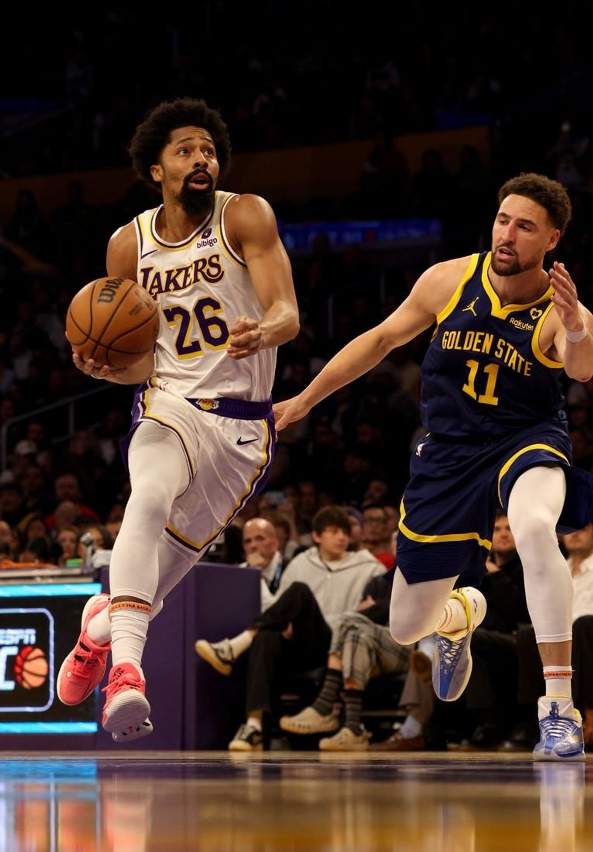 Mar 16, 2024; Los Angeles, California, USA; Los Angeles Lakers guard Spencer Dinwiddie (26) drives against Golden State Warriors guard Klay Thompson (11) during the second quarter at Crypto.com Arena.