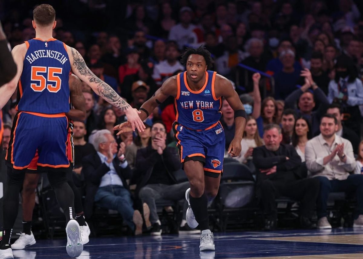 Jan 27, 2024; New York, New York, USA; New York Knicks forward OG Anunoby (8) slaps hands with center Isaiah Hartenstein (55) after a basket against the Miami Heat during the first half at Madison Square Garden.