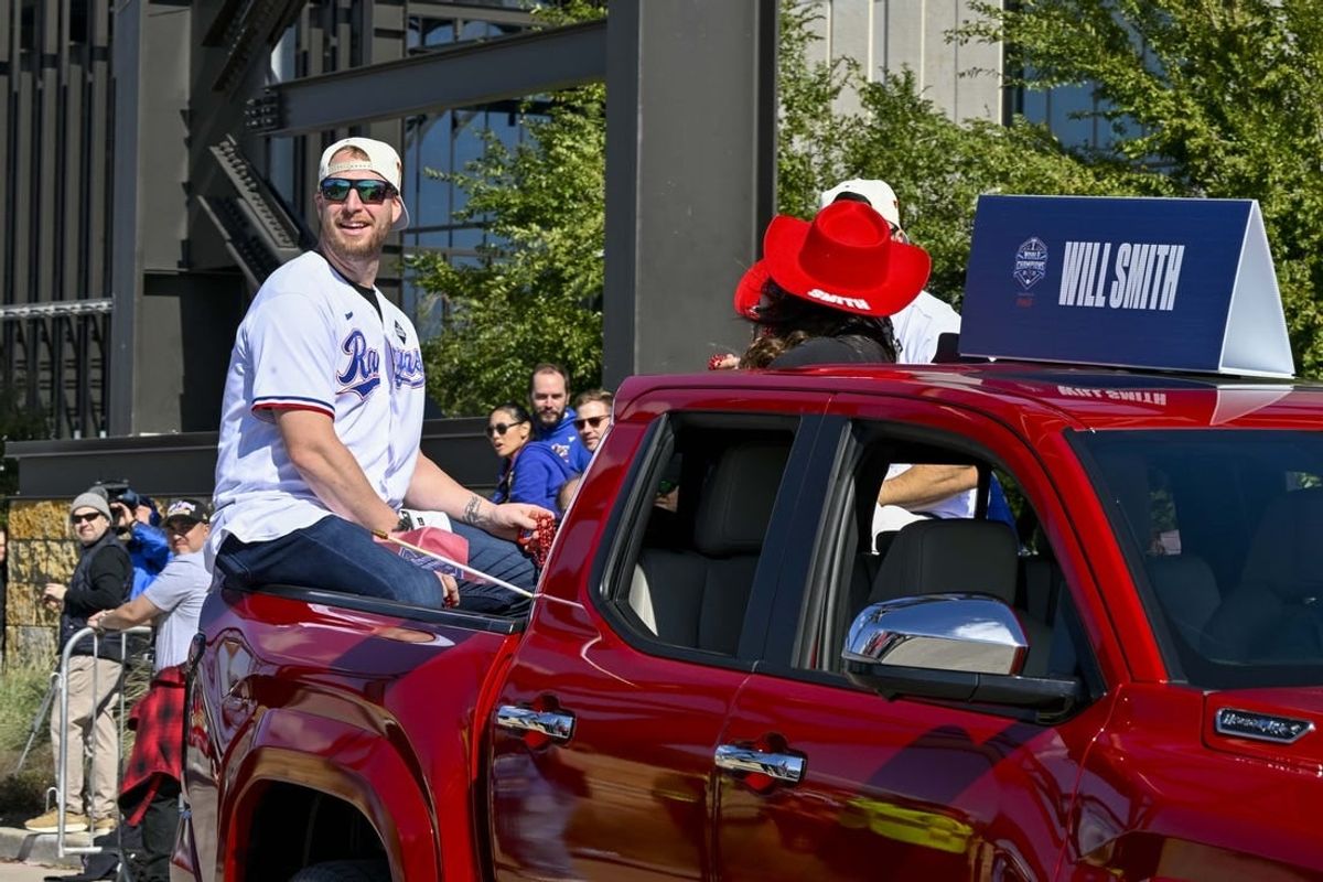 Nov 3, 2023; Arlington, TX, USA; Texas Rangers relief pitcher Will Smith (51) during the World Series championship parade at Globe Life Field.