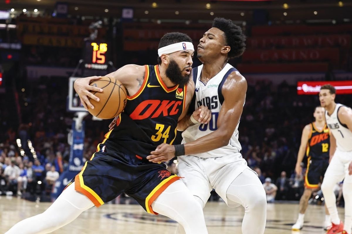 Apr 14, 2024; Oklahoma City, Oklahoma, USA; Oklahoma City Thunder forward Kenrich Williams (34) drives against Dallas Mavericks guard Brandon Williams (00) during the second half at Paycom Center.