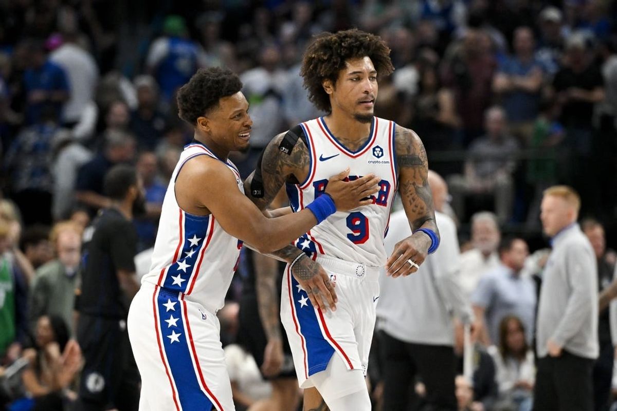 Mar 3, 2024; Dallas, Texas, USA; Philadelphia 76ers guard Kyle Lowry (7) and guard Kelly Oubre Jr. (9) celebrate during the second half against the Dallas Mavericks at the American Airlines Center.